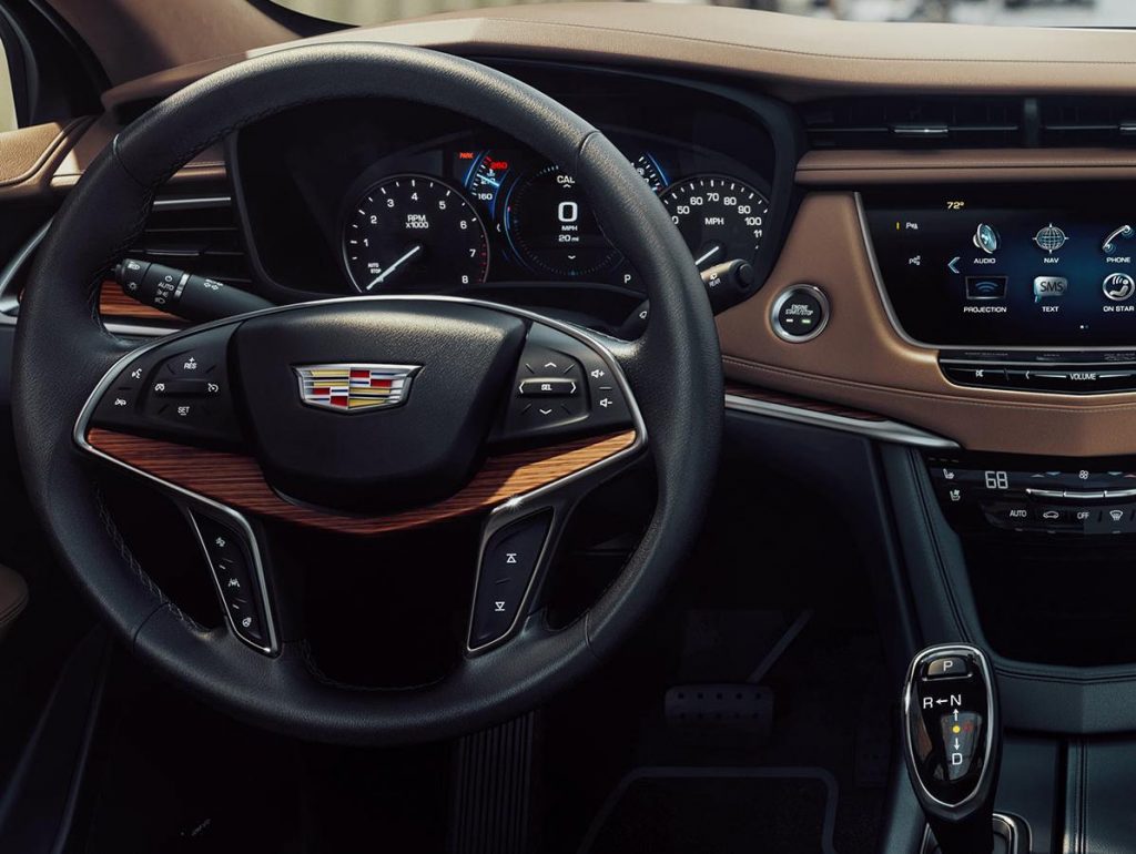 A Cadillac dashboard. A Diminished Value Appraiser in Miami, Florida call 772-359-4300.